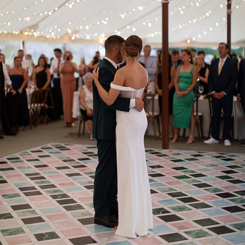 This bride and groom had their dance floor covered with a vinyl dance floor wrap printed with multiple colored marble tiles. Very classy but in a colorful way.