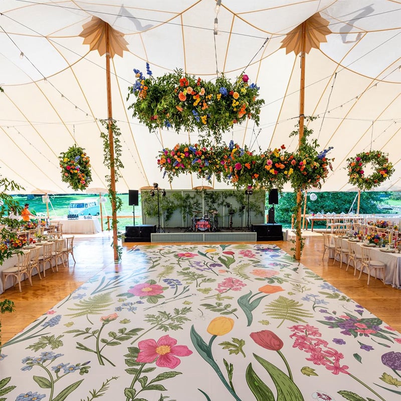 Spring flowers were printed on this custom vinyl dance floor wrap to match the beautiful spring flower floral arrangements throughout this wedding venue.