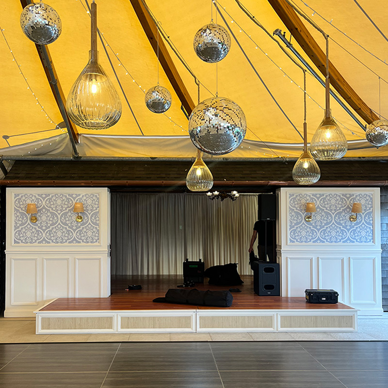 Printed wall graphics and decals matching those used throughout the reception hall were also used to give the band's stage a custom look.