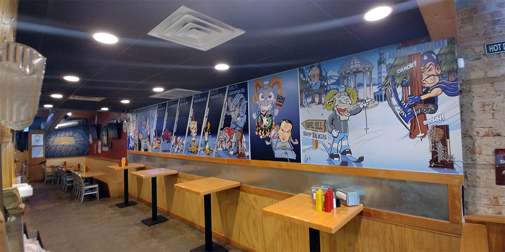 Sup Dogs in Chapel Hill, NC celebrates UNC college sports with these wall murals.