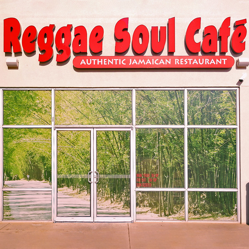 The Reggae Soul Cafe had too much sun coming in through the floor-to-ceiling windows that fronted the storefront of their Jamaican restaurant. The solution was a floor-to-ceiling perforated window film printed with an image of a bamboo forest.