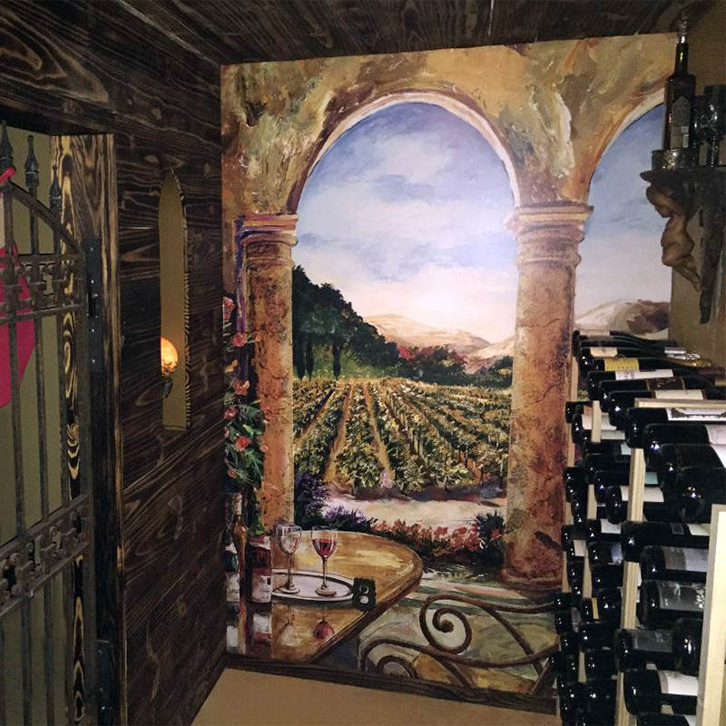 This picture shows us how an Italian restaurant with a small wine cellar gave it a grand view with our Sedona Portico mural that features a view off a balcony and across a Neapolitan vineyard. It's a great way to make a small space seem much bigger.