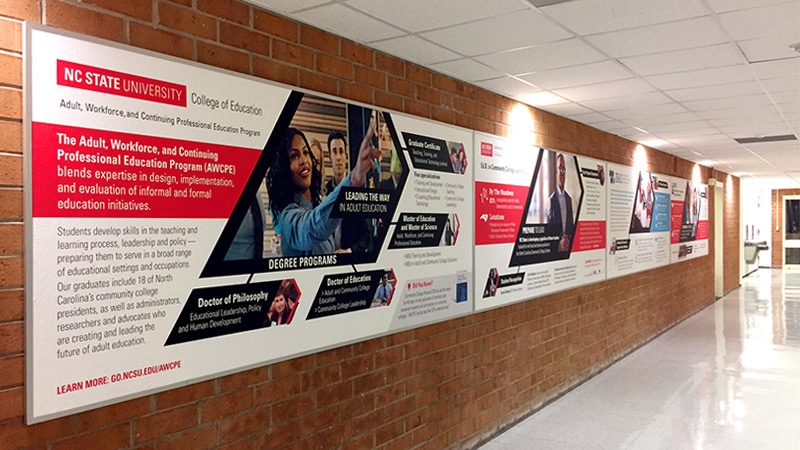 Bulletin boards in school hallways get a facelift when wrapped with quality wallpaper. This one at NC State University not only helps build the schools brand, but informs students & visitors of the school’s programs, mission & values.