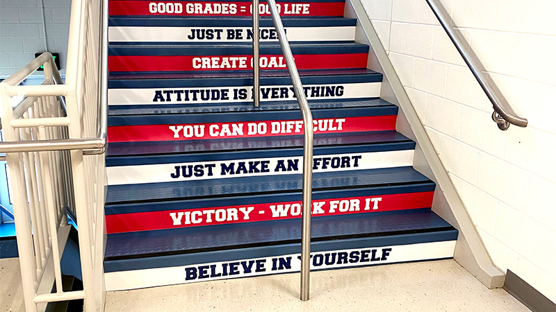 Each and every riser in this school’s stairwell features an inspirational or motivational message designed to raise the student spirit while also raising them to their next class. Make the most of your stairways with decals just like this school did.