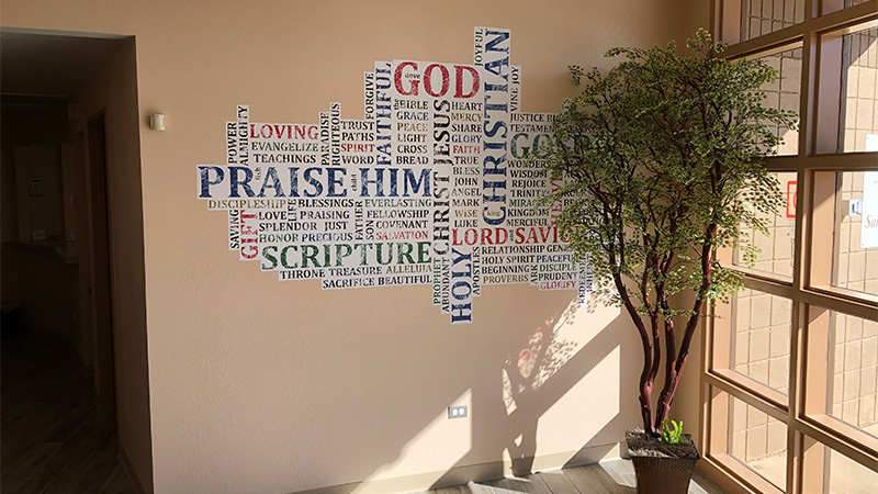Word Art Murals. This is a custom printed and custom cut decal featuring a word cloud of Christian-themed words such as God, holy, scripture, Lord and Savior, etc.