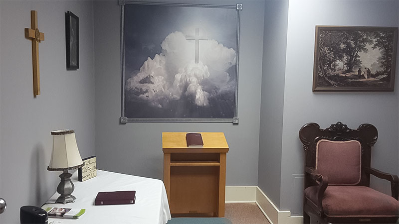 One of the counseling areas at the Waverly United Methodist Church includes a framed wallpaper mural of our "Clouds and Cross" hung behind the kneeler for personal devotion.