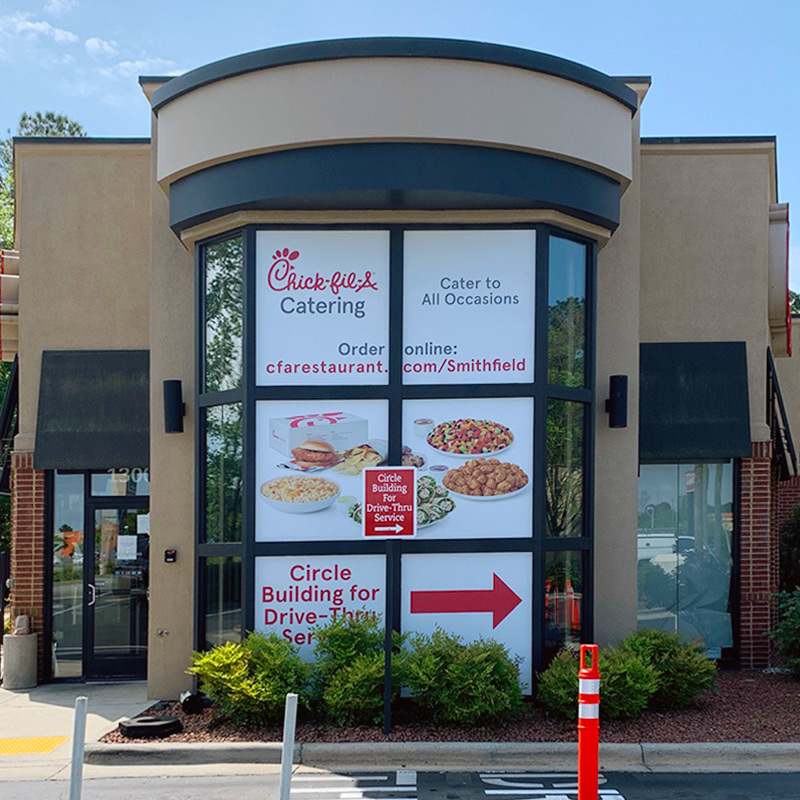 Corporate branded window graphics share important business messaging with customers inside and outside of the building.