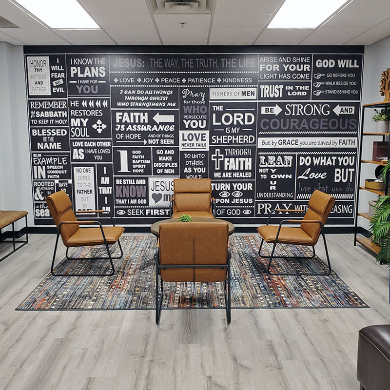 While this looks like chalkboard art, it is in fact a wallpaper wall mural featuring Christian-themed word art and spiritual phrases and Bible verses.