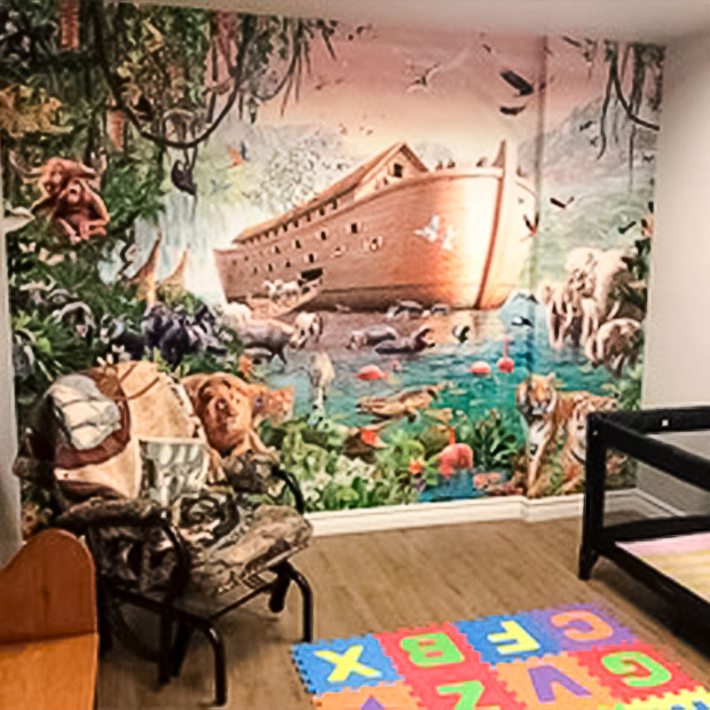 A stunning rendition of Noah's Ark by acclaimed artist Adrian Chesterman features in this church nursery. Not only do the kids love it, but so do the adults.