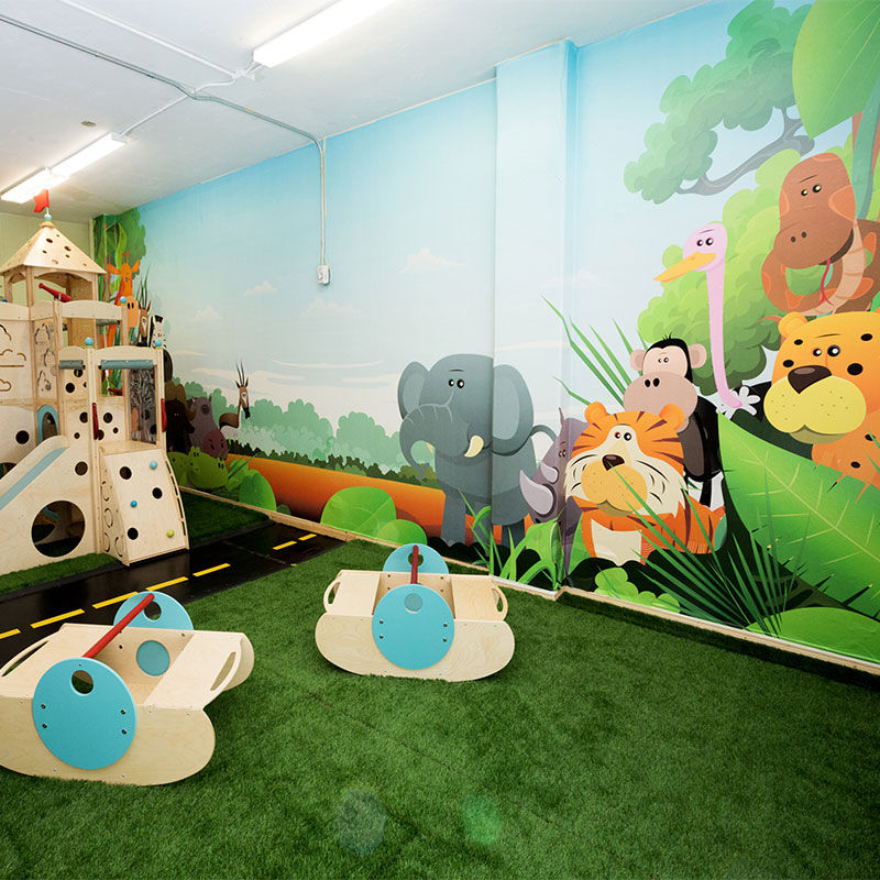 The daycare and play area of this church is decorated with a wall mural featuring elephants, monkeys, leopards, tigers and other cute jungle animals.