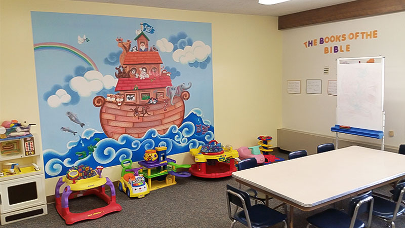 The younger children's classroom at St. John's Lutheran church is adorned with an illustrated wall mural depicting Noah's Ark and it's many animals.