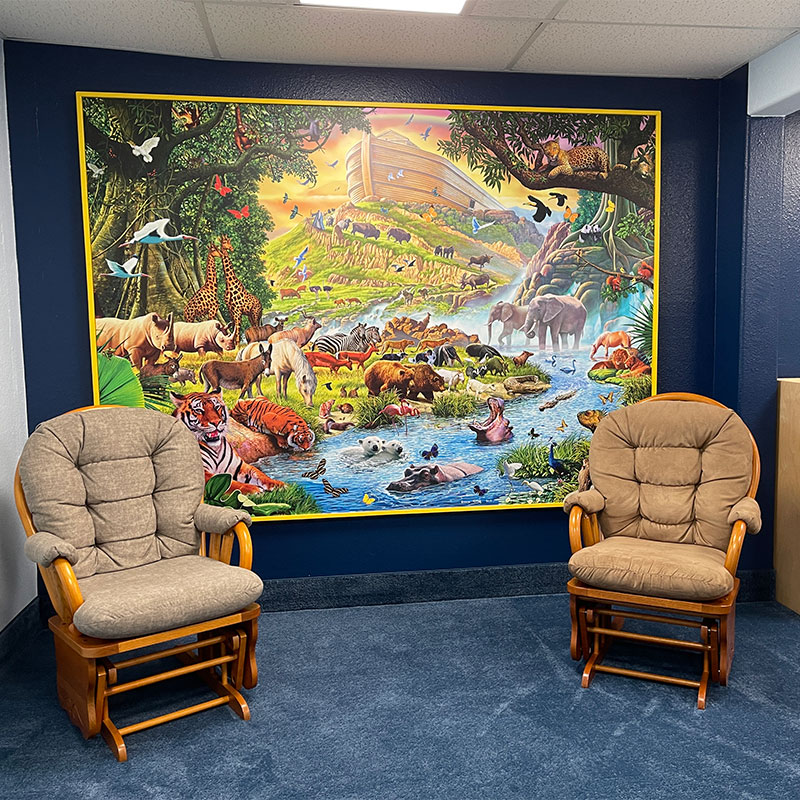 Cheyenne Baptist Temple Church framed a large printed mural of "Loading Noah's Ark," by acclaimed artist Steve Crisp and hung it in an area used by parents and toddlers in one of their program rooms.
