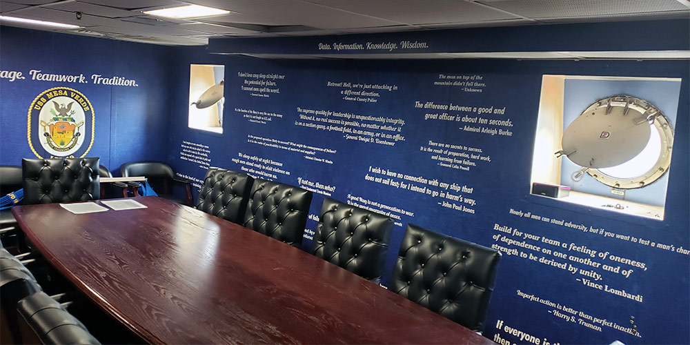 Word art and famous motivational quotes have been used to create a wall mural that energizes employees and builds company morale.